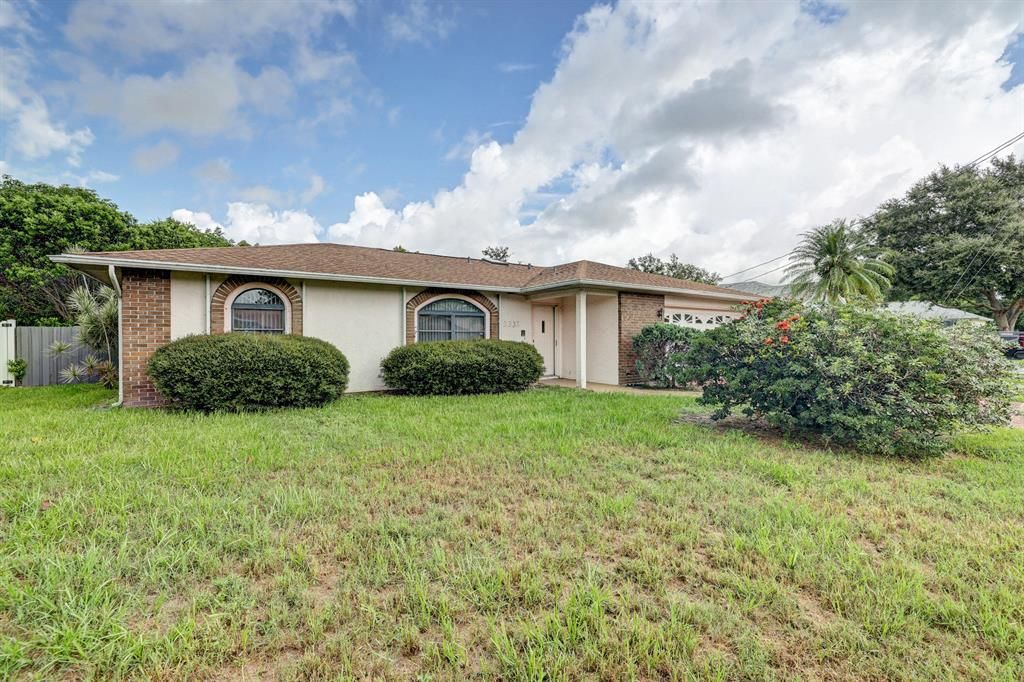 Photo of 2332 SW Woodridge Street, Port Saint Lucie, FL 34953 (MLS # R10730897)