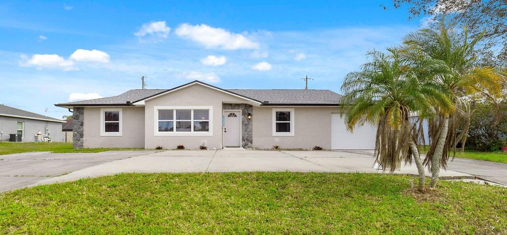 Photo of 135 SW Ridgecrest Drive, Port Saint Lucie, FL 34953 (MLS # R10961276)