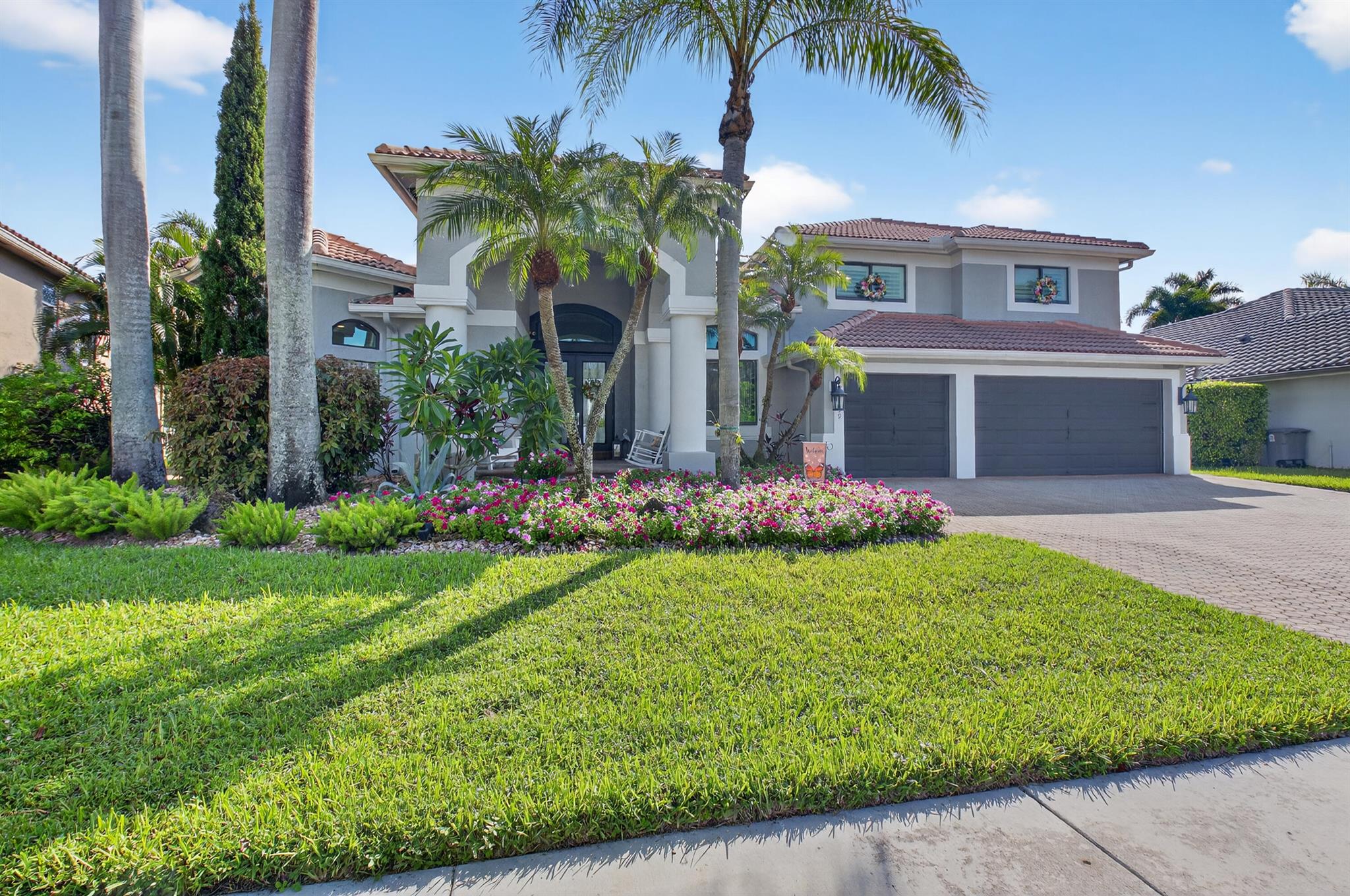 WHY WAIT TO BUILD WHEN YOU CAN HAVE THE ''BEST'' IN BOCA ISLES ON A SPECTACULAR WATERFRONT LOT. THIS PALM BEACHER ESTATE HOME IS LOCATED IN THE RESERVE SECTION OF BOCA ISLES SOUTH. 5 BDRM 3 BA 3 CG LAKEFRONT SCREENED POOL HOME WITH AN AMAZING PATIO...PERFECT FOR ENTERTAINING. MOVE IN READY. TRAVERTINE MARBLE FLOORING IN THE MAIN AREAS THROUGHOUT THE FIRST FLOOR . LARGE FORMAL LIVING AND DINING ROOM...THE CHEF'S DREAM KITCHEN FEATURES CUSTOM CABINETRY, GRANITE COUNTERTOPS, BRAND NEW DOUBLE INDUCTION STOVE AND BOSCH REFRIGERATOR. THE KITCHEN ALSO FEATURES A LARGE COUNTER FOR GUESTS TO DINE, AS WELL AS A CUSTOM SEATING AREA WITH SUPERB VIEWS, ADJACENT TO THE KITCHEN IS A SPACIOUS FAMILY ROOM WITH A CUSTOM BUILT IN WALL UNIT. NEW PLANTATION SHUTTERS TOO!