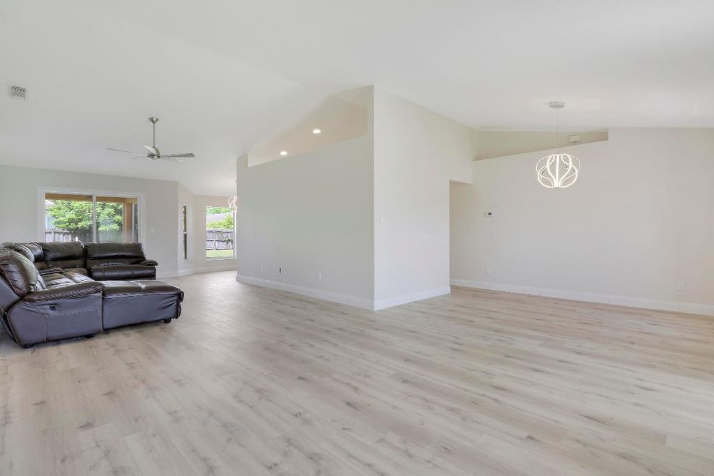 Photo of 497 SW Lacroix Avenue, Port Saint Lucie, FL 34953 (MLS # R10937029)
