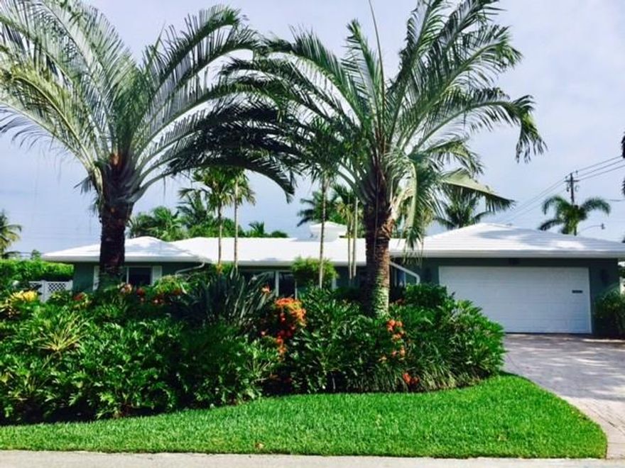 Coral Ridge Country Club Estates. Corner home in move in condition. Split floor plan. Master bedroom has 2 walk-in closets. White kitchen completely remodeled with induction stove and convection microwave. Built-in-entertainment unit with Bose surround sound. Wet bar in dining room. Impact windows and doors. Lush garden with private pool and backyard area with a tiki area! Walk to beach, restaurants and shops. Roof and stainless steel appliances under warranty.