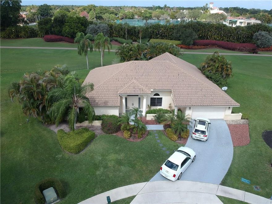 Beautiful single family 3/3.5 Corinthian pool/spa home with features that include: Newly replaced roof in 2017, custom wood cabinets with granite counter tops, large, fenced lot on cul de sac, volume ceilings, split bedroom plan, open kitchen to family room, well water for big savings, each room has it's own bathroom. Boca Woods is a mandatory membership country club community and features a newly built 2 story spa & gym facility with panoramic golf views, sauna/steam room, massage therapist, two championship 18 hole golf courses, lighted putting/chipping area, driving range, pickle ball courts & 7 hartru tennis courts. The golf membership is $75,000. Call listing agent for details. Property has Pool heater that does not work. Seller is not warrantying.