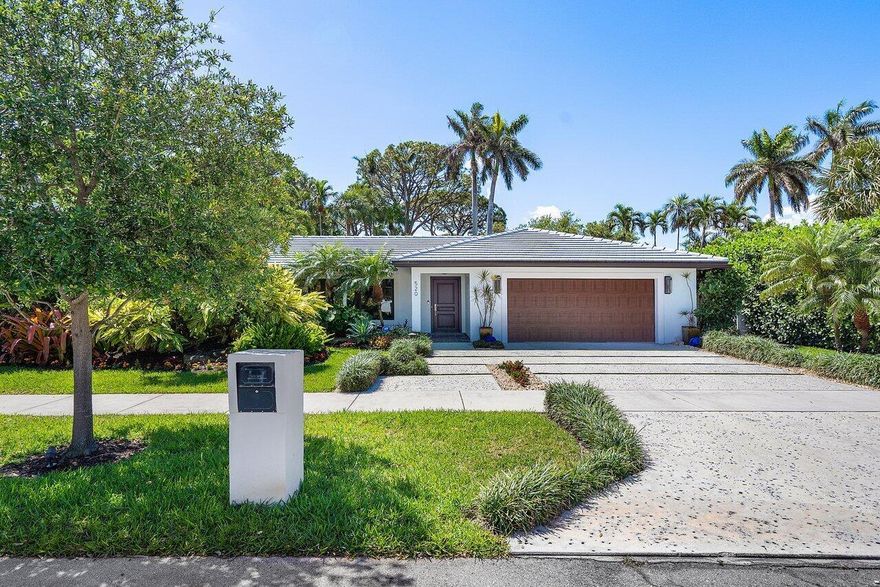 Located in Boca Raton's golden triangle, this newly renovated three-bedroom pool home offers a short walk to Mizner Park & 5th Ave Shops, and mere moments to the beach and Boca Resort. The home features a new kitchen with Bosch appliances, quartz countertops, and shaker cabinetry. Beautifully upgraded bathrooms throughout with quality fixtures and designer tiles. The primary suite features large picture windows and a custom built-out closet. The backyard offers incredible privacy with an expansive covered patio, a free-form heated pool, lush landscaping, & room for children and pets to play. Other features include a large two-car garage, and an expansive utility room with a second refrigerator.