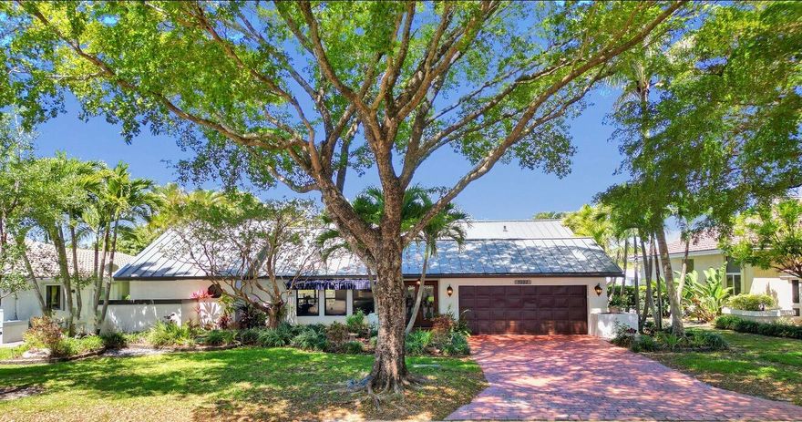 Beautifully updated 4 bed,3 bath Poinciana model in desirable Hidden Hammocks offering 2,282 living square feet with tranquil lake views and a resort style pool and spa just steps from Park Springs Elementary & Volunteer Park. This move in ready home features a 2024 metal roof, complete impact windows & doors, updated electrical panel, new stainless steel appliances, light fixtures & ceiling fans. The split floor plan provides privacy for the primary suite with custom cabinetry, barn door closet entry, and updated finishes. Enjoy tropical landscaping/covered patio space.Black Emerald PebbleTec pool finish, pool pump 1 yr old. Bathrooms feature quartzite natural stone countertops while the cabana bath offers Corian countertops. Low HOA near parks,shopping,dining & major roadways.