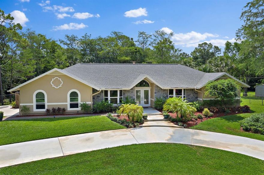 This gorgeous 4BR 2BA Palm Bch Country Estates home has been masterfully renovated.  The large eat in kitchen boasts beautiful cabinetry, double pantry's & quartz countertops. You will love the large living room with wood burning fireplace. The large master suite has a gorgeous master bath is complete with soaking tub and a large walk in shower with full body jets and rain shower head. The spacious walk in closet is fitted with a California closet system.  This immaculate home has been recently painted inside and out.  Lovely hardwood floors have been installed in all bedrooms. There are brand new baseboards, crown molding, door & window casings. Over 50 LED recessed lights have been installed. The home is complete with all impact windows & doors & has a new 5ton a/c & 80 gal water heater The yard was cleared of over 20 trees and professionally landscaped and has an updated zoned sprinkler system on a well.    A Clusia hedge has planted to give the home privacy and an estate feel. This home is a provides nature & privacy all just a stone throw from golf, beaches, fishing, shopping, restaurants, I-95 & TPK in the heart of Palm Beach Gardens.