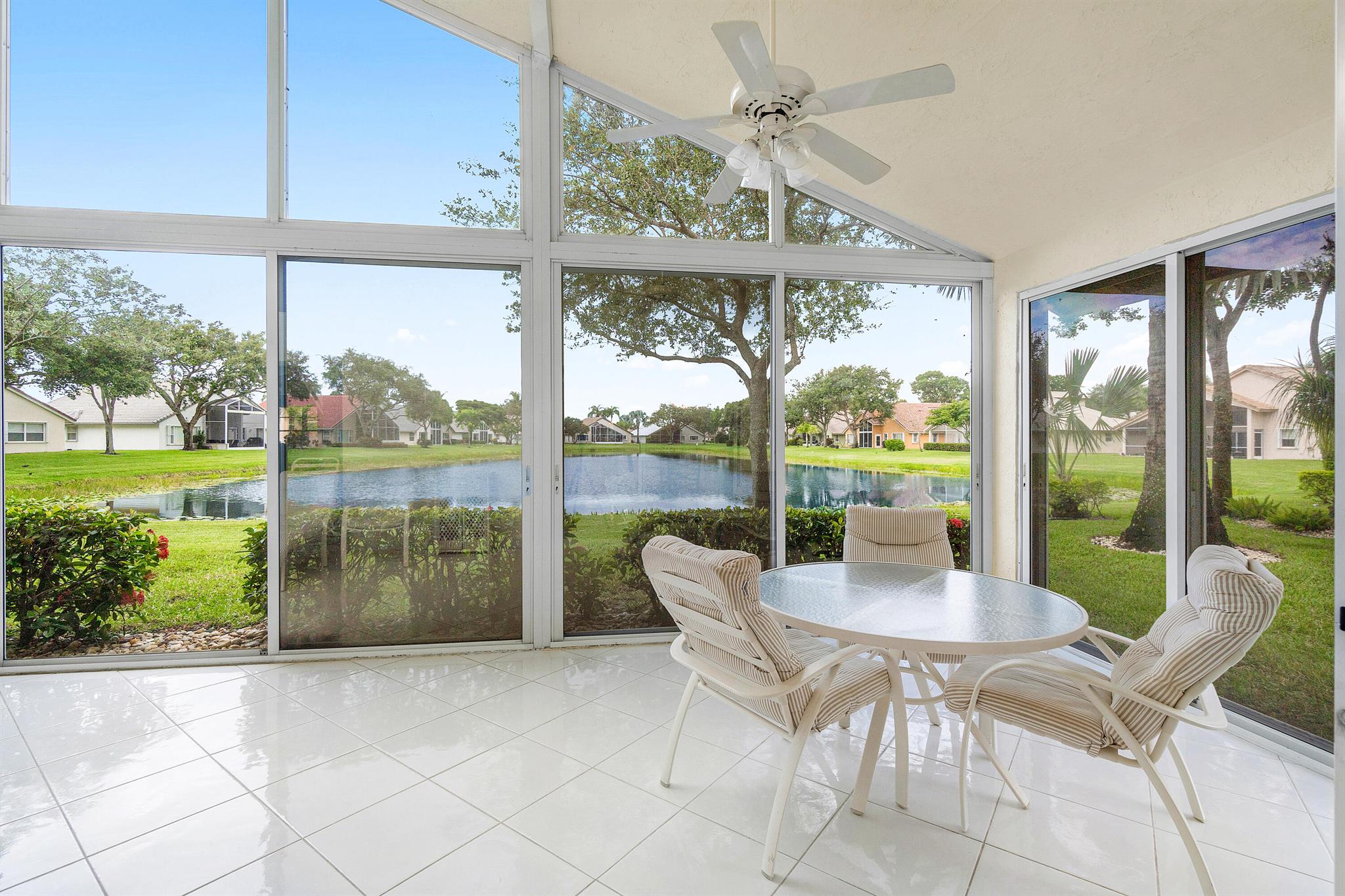 Enjoy STUNNING long lake views from this beautifully maintained 3-bedroom, 2-bath home in a desirable active 55+ community or Lakeridge Greens. Enjoy peace of mind with recent upgrades including a new roof (2022), A/C (2020), and water heater (2023). The spacious split-bedroom floorplan provides privacy and flexibility, ideal for guests or a home office. An oversized glass-enclosed lanai adds an additional 341 sq ft under air, perfect for year-round enjoyment of the peaceful lake views. Don't miss your chance to live in this vibrant, amenity-rich neighborhood!