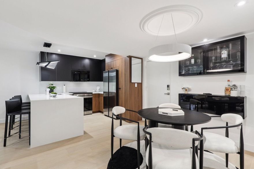 Experience the ultimate blend of luxury + accessibility in this Ground floor, Corner, 2 Bed 2 Bath condo. Meticulously renovated and offered fully turnkey if desired. Brand new kitchen with quartz counters, European cabinets & Samsung appliances. Spa inspired bathrooms with rain showers & high end finishes. Vinyl flooring thruout. Walk in closets in both bedrooms. Lighting is dimmable/color changing for bright or warm lighting. Impact windows & sliders. Patio offers easy access in & out. Parking space in front of unit. Community has new roofs, beautiful grounds, heated pool, 40 yr report done. HOA includes bldg insurance, internet, water, pest control, full reserves, management & more. Cat friendly + ESA/Service dog friendly. All of this in a prime location just 5 min walk to Wilton Drive