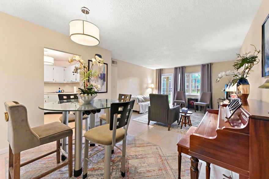 Welcome to Manor Grove Village Condominium! This well-maintained condo features a desirable first-floor unit offering approximately 1,200 sqft of living space with 2 bedrooms and 2 bathrooms. The home offers tile flooring throughout the main living areas and carpeted bedrooms for added comfort.  The kitchen comes equipped with appliances and has seen several important upgrades. Major improvements completed in 2020 include a new A/C system, water heater, refrigerator, dishwasher, garbage disposal, electrical upgrades, and updated fans and ceiling fans. In 2026, additional enhancements were made with new light fixtures in the bedrooms and bathrooms, adding a fresh, modern touch. Enjoy added peace of mind with hurricane impact windows throughout the unit. Relax in the covered and screened patio, perfect for morning coffee or evening unwinding, plus a convenient storage room for extra space.  A great opportunity to own an upgraded and move-in-ready condo in a well-established community!