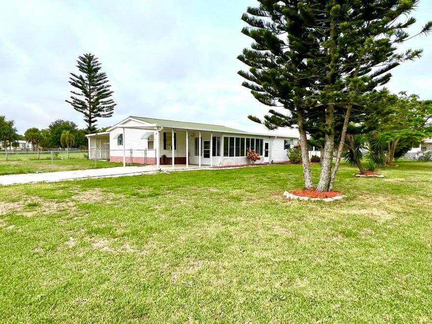 Beautiful Lot with double-wide mobile home in Buck Head Ridge offers a comfortable and functional living space. With two bedrooms and two baths, plus an office, it provides ample room for both living and working. The 1,256 sq ft interior is ready for your personal touch and a bit of TLC to make it your own. Updated supply plumbing throughout the house. New shower valves in the master and guest bathrooms. 
The property includes a generous 20x12 workshop, perfect for hobbyists or extra storage needs. The 14x40 carport at the back is large enough to shelter a boat, making it an excellent choice for water enthusiasts. Situated on a nice corner lot, the home features a Fully fenced back yard. CASH ONLY measurements her approximate.