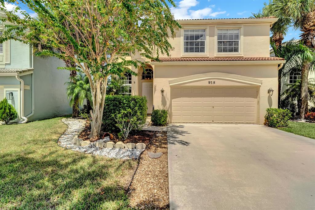 You'll find space and style in this lake-view home located in a resort-style community. Here you'll find an open-concept floor plan featuring updated fixtures and finishes and design details including tile flooring, arched windows, updated lighting. Lovely kitchen includes stainless steel appliances, custom cabinetry, and an expansive seated bar for dining. Owner's suite features ample closet space and en suite bath with double-sink and seated vanities. Your favorite spot might just be the elegant, private lanai, offering a screened terrace with plenty of room for outdoor seating, dining and entertaining. Enjoy the convenience of double-bay garage; panel shutters offer added storm protection and peace of mind.Rent includes 4 manned gates and onsite security!