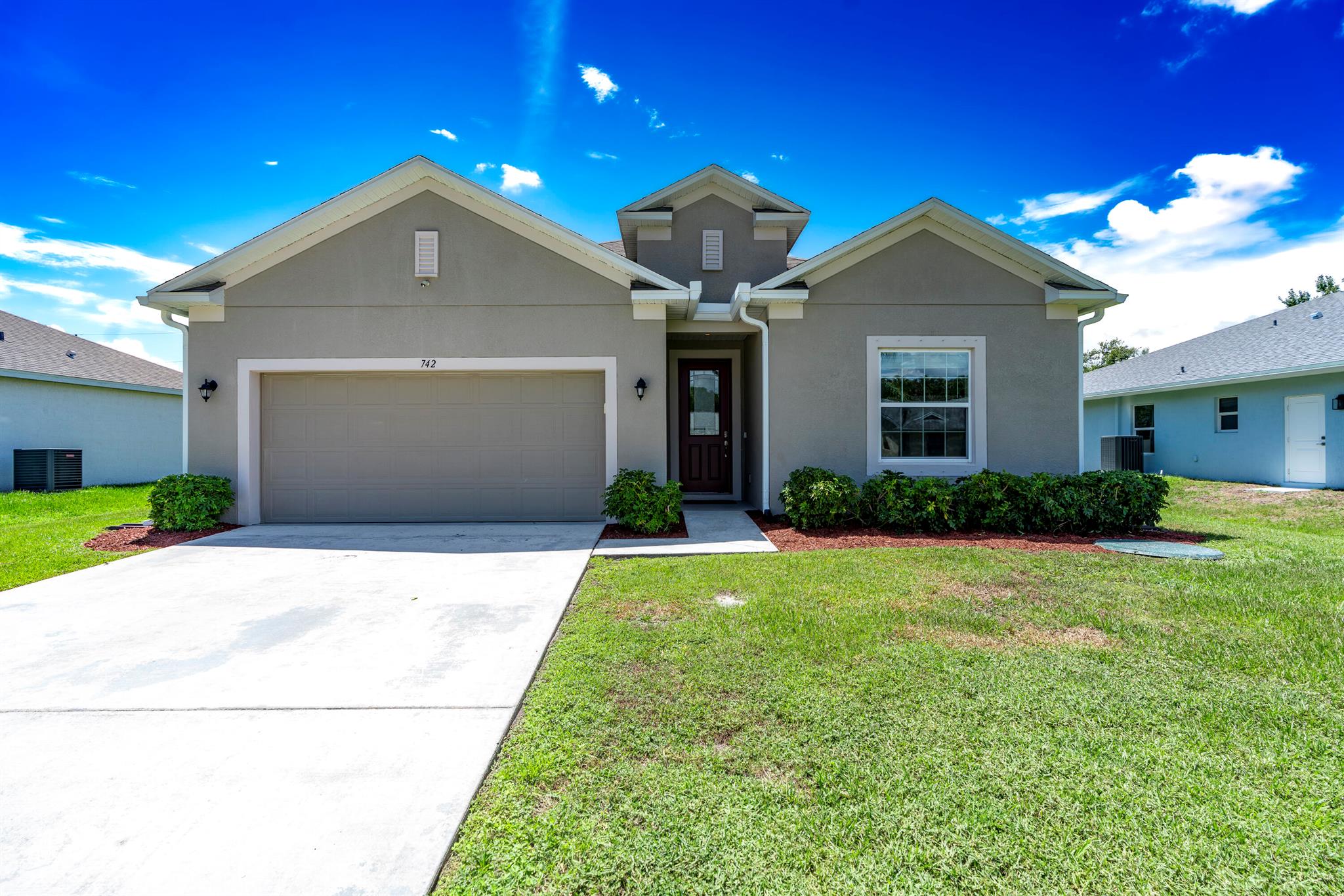 Stunning 4-bedroom 2-bathroom home built in 2019 with Smart features, combines comfort with modern convenience. From the moment you enter, you'll notice the open layout and elegant porcelain tile floors flowing throughout the main living areas.The heart of the home is the chef's kitchen, complete with a large island, stylish pendant lighting, and an oversized pantry for all your storage needs. Sliders open wide to seamlessly connect indoor and outdoor living, creating the perfect space for entertaining. The private primary suite is a true retreat, featuring a walk-in closet and a spa-inspired ensuite with a soaker tub, separate shower, and dual vanities. This home is thoughtfully equipped with smart wiring, smart switches, and remote or app-controlled fan systems, making it both