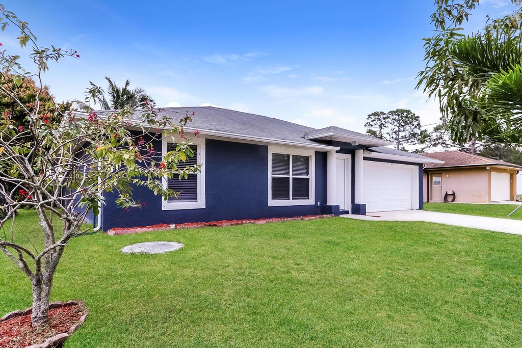 Photo of 573 SE Sweet Avenue, Port Saint Lucie, FL 34983 (MLS # R11055268)