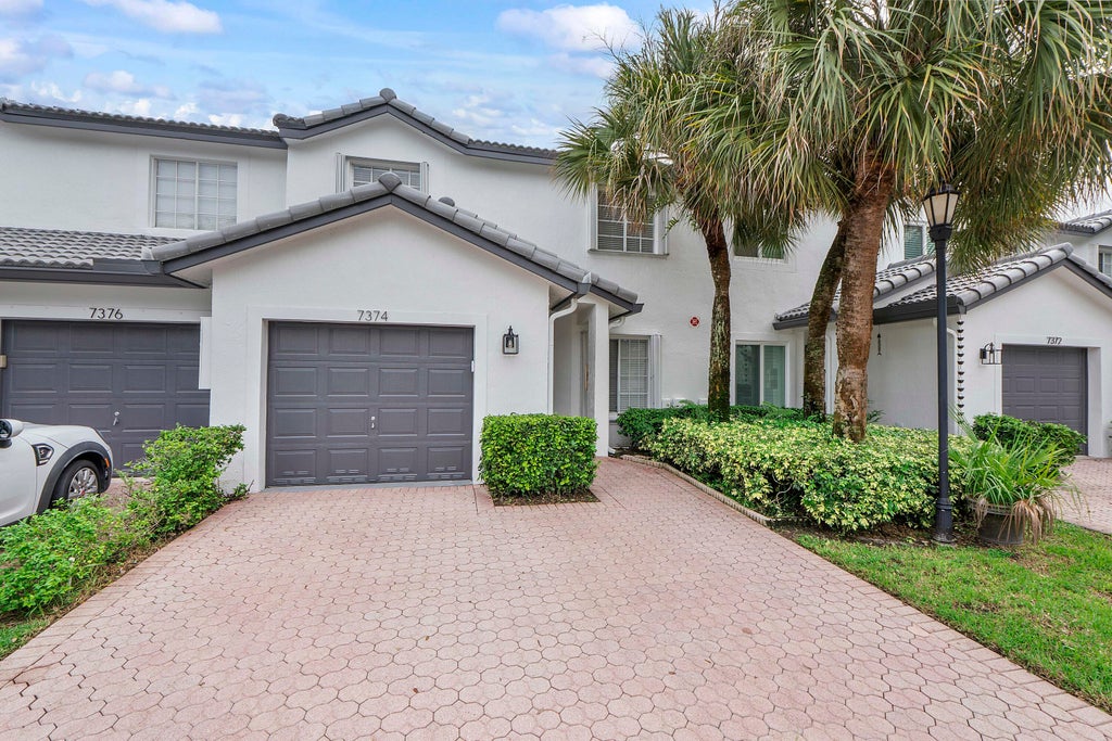 Photo of 7374 NW 61ST Terrace, Parkland, FL 33067 (MLS # B26085330)