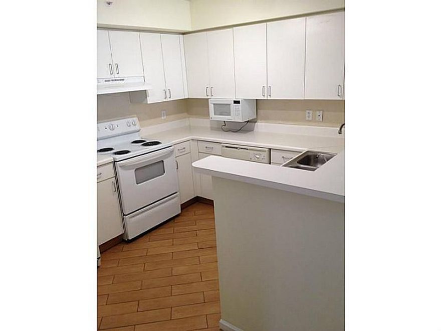 BEAUTIFUL AND CLEAN 1/1 FIRST FLOOR UNIT IN THE VERY DEMANDED COMMUNITY OF CARRINGTON COCONUT CREEK. FRESHLY PAINTED. WOOD LOOK TILE THROUGHOUT. FILTERED WATER. WASHER/DRYER. RENT INCLUDES BASIC CABLE, WATER AND CONCIERGE TRASH REMOVAL. LOTS OF AMENITIES INCLUDING AMAZING RESORT STYLE POOL AND SPA, GYM, INDOOR RACQUET BALL, CLUBHOUSE WITH BUSINESS CENTER, PLAYGROUND. CLOSE TO NEW MALL, RESTAURANTS AND A+ SCHOOLS. WATER/CABLE INCLUDED.