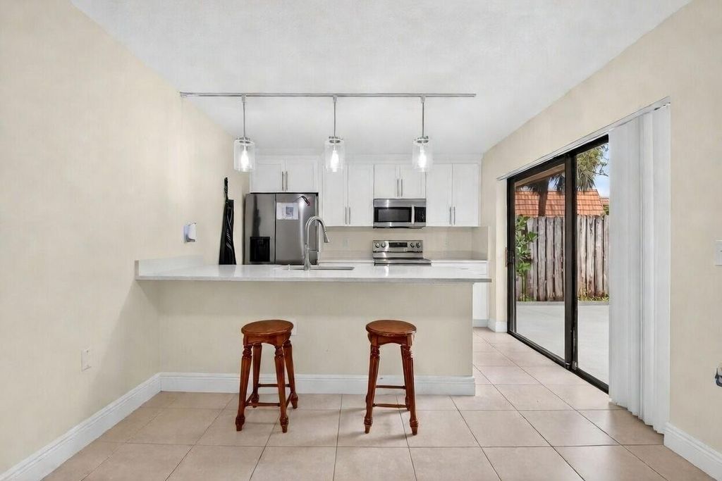 Photo of 590 Green Springs Place, West Palm Beach, FL 33409 (MLS # B26004679)