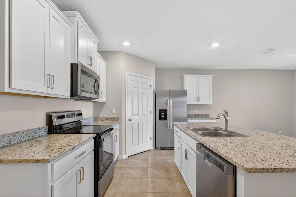 Photo of 6556 NW Oaklawn Way, Port Saint Lucie, FL 34983 (MLS # F10551720)
