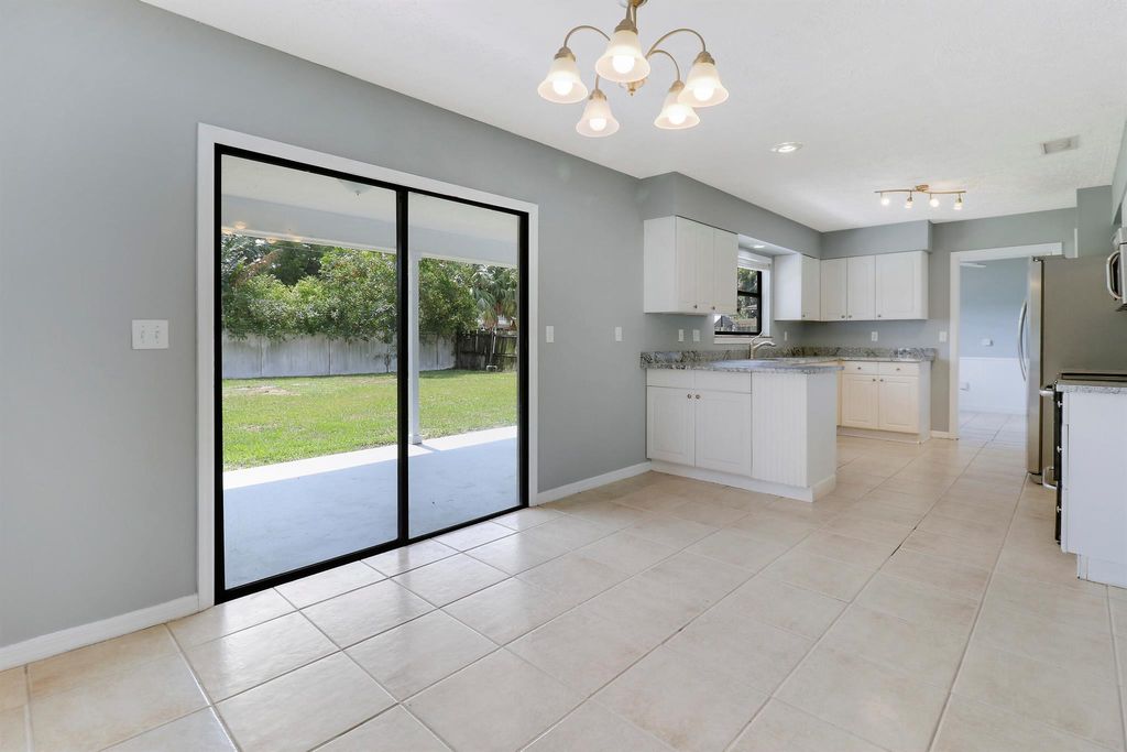 Photo of 1429 SE Ladner Street, Port Saint Lucie, FL 34983 (MLS # R10989863)