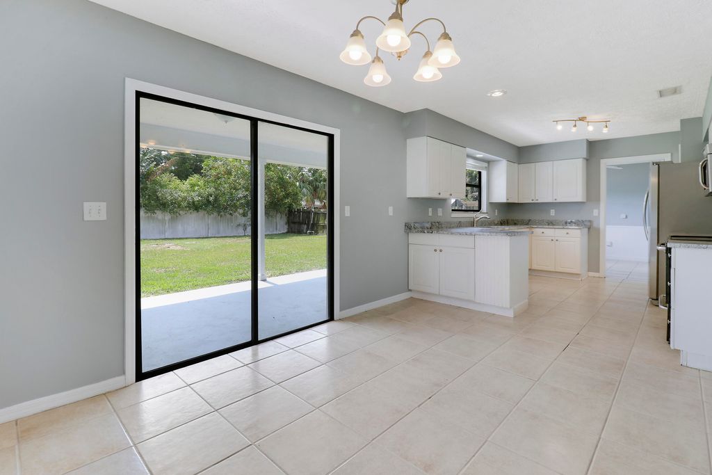Photo of 1429 SE Ladner Street, Port Saint Lucie, FL 34983 (MLS # R10989863)