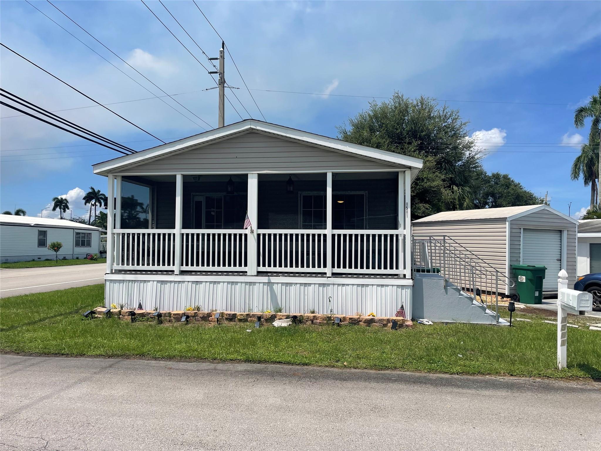 Beautiful 2/2 double wide with screened in patio - -Huge 10x16 shed - -on oversized corner lot in sec 1 with low maintenance fees- -Gorgeous wood laminate floors through out -- -Built in 2008 - -so financing is available - updated cabinetry with multiple lights - Central A/C is approx. 3 years new - -Assoc. states it is HOPA verified - -priced right for quick sale - -truly a must see........