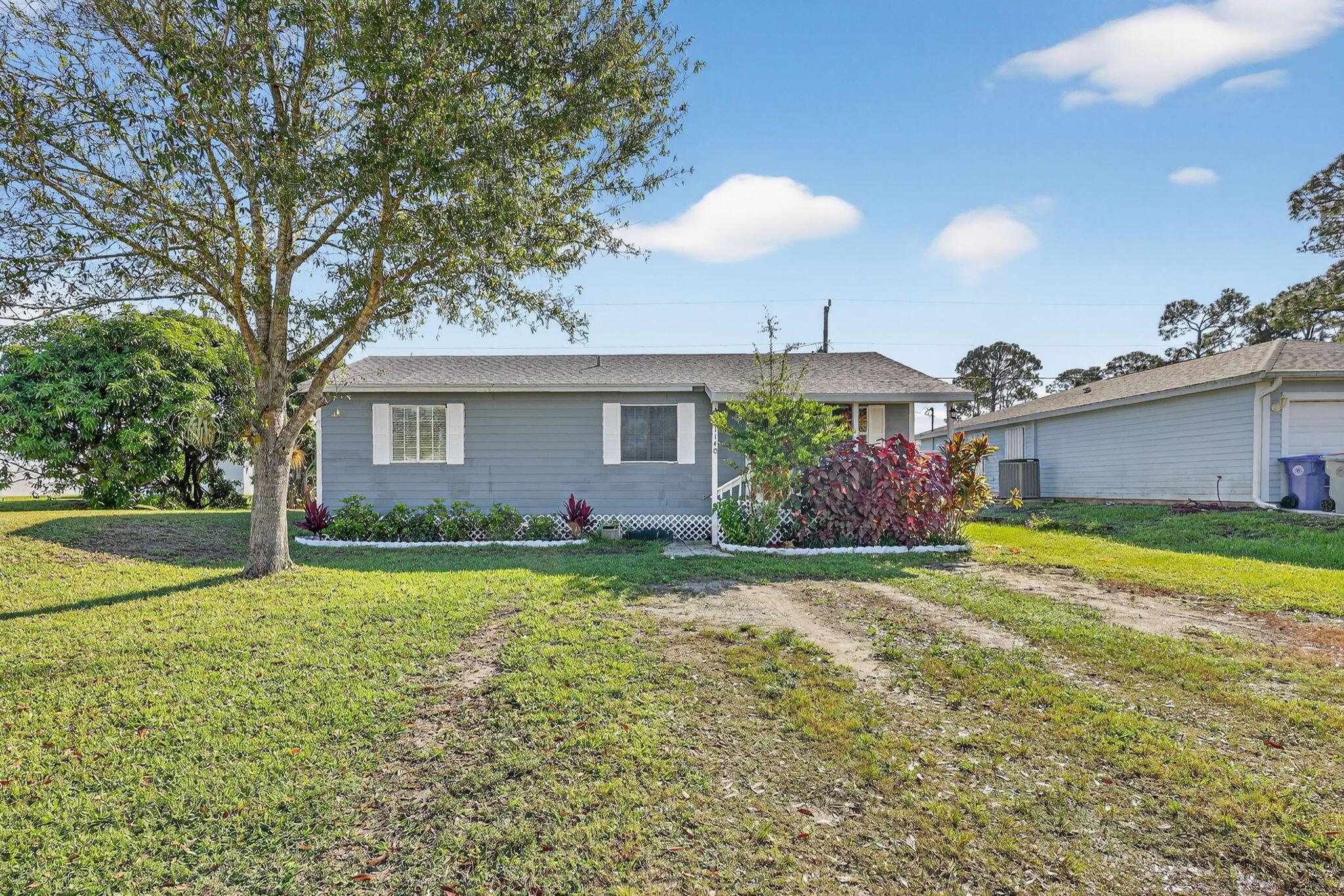 Welcome home to this move-in ready 3BD/2BA in the heart of Vero Beach! Featuring a brand-new roof and set on a spacious DOUBLE LOT(10,000SqFt), this property offers excellent long-term value and plenty of room to grow. Enjoy your own tropical retreat with mature mango, banana, and citrus trees. Relax on the covered front porch with your morning coffee or unwind while watching the sunset. ONLY 12 minutes to the beach! Located in a friendly, fast-growing neighborhood close to the recreation center, Indian River Mall, and Vero's beautiful public beaches. Oslo road I-95 exit coming 2026-27 for ease of travel north and south. Formerly owned by an insulation professional, the home stays energy-efficient--warm in winter and cool in summer. Move right in and start living the Vero Beach lifestyle!