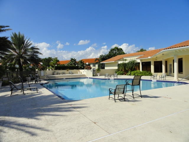 Photo of 1561 WINDORAH Way #C, West Palm Beach, FL 33411 (MLS # B26069841)
