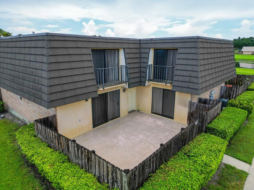 Ready to move in.  Freshly painted - light & bright 2 bedroom, 2 1/2 bath townhouse  conveniently located in the Village of Sandalwood in West Palm Beach Minutes to shopping, restaurants, schools,Ball Park of the Palm Beaches, Palm Beach International Airport, City Place , Downtown West Palm Beach & more. Features: Washer Dryer  in townhouse, dishwasher, 2 private bedrooms & bathrooms upstairs, private fenced patio area  that is perfect for entertaining & BBQ. Community Offers: 3 private parks each with their own tennis courts, green spaces, swimming pools, playgrounds & more. The Ballpark of the Palm Beaches is next door providing MLB spring training entertainment with the Houston Astros and Washington Nationals.  Additionally the Village Paws Park is a county dog park 1 mile away.