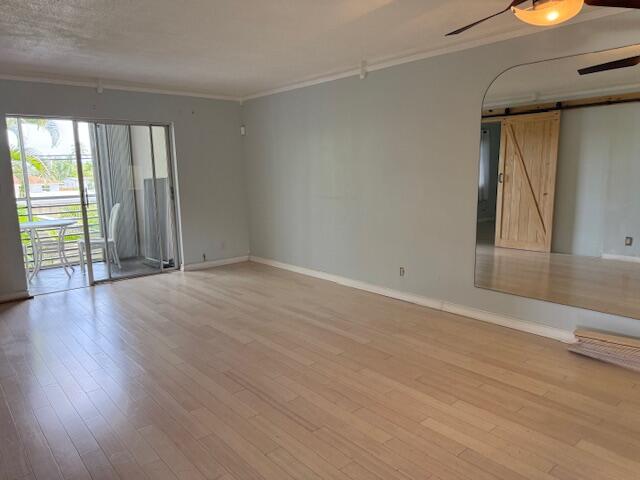 Vacant, beautiful end unit with very private screened balcony, hurricane shutters and tiled! Bamboo hardwood floors throughout the unit. This unit has barn doors to close the 2nd bedroom, which comes with own half bath and walk in closet. This unit has extra windows, even both bathrooms have windows. Building has elevator, this unit has also easy access with stairs to use. This is well maintained 55+ community. This building 25 is located close to satellite pool, but can use the larger pool area located next to amenities and management office.