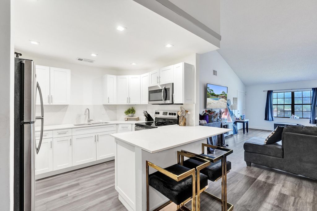 Photo of 4225 S 57th Avenue #E, Greenacres, FL 33463 (MLS # B26044964)