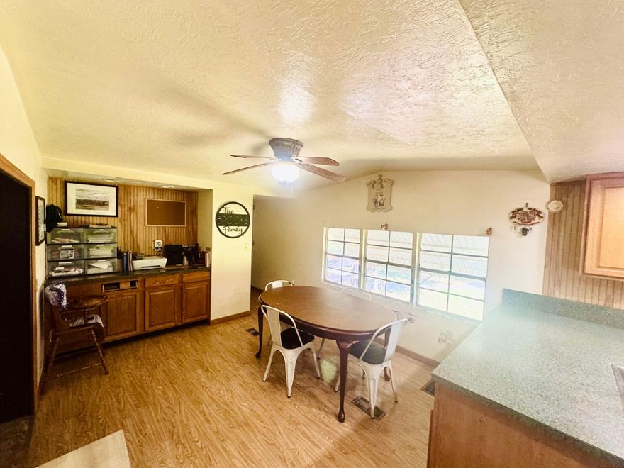 If you are looking for a quiet area to live with lots of open land, then this is your property! With oak trees lining the property for privacy, you will find the main 2/2 manufactured home, workshop, and a 1/1 guest house (need some tlc). Workshop has a/c unit and a half bathroom for the handyman that likes to work outside. Workshop can also be used for a processing room for the cattle enthusiast. Many water lines throughout the property for agriculture or cattle farming. Alot of fruit trees and seasonal plants, 2 car covering carport wired for 220V and 110v. Property may be bigger than showing on tax records. Owner is paying for updated land survey. New owner  benefit from having an already completed survey showing larger land size and only paying for 4.92 acres. Don't let this deal go!