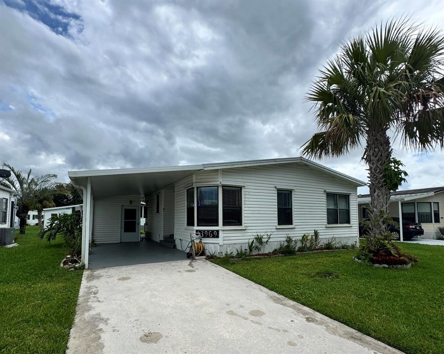 2-bedroom, 2-bath home on a quiet street, conveniently located near the entrance of the desirable 55+ Spanish Lakes Fairways community. The house has no carpet--an open kitchen space with an eat-in kitchen area. The home has a new metal roof in 2024. New A/C and custom-made hurricane shutter panels. This home has two sheds. Home is a fixer-upper. Floors will need some repair, and the primary suite bathroom and guest bedroom will need some drywall work. Price is reflective of repair needs.  Lawn care and trash removal are included in the lot rent, as well as an 18-hole golf course, two pools, tennis, pickleball, bocce ball, and shuffleboard: clubhouse, and much more.