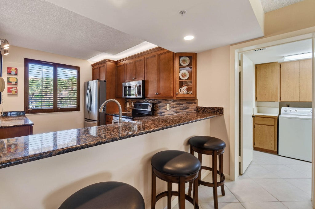 Photo of 2101 Marina Isle Way #202, Jupiter, FL 33477 (MLS # B26062804)