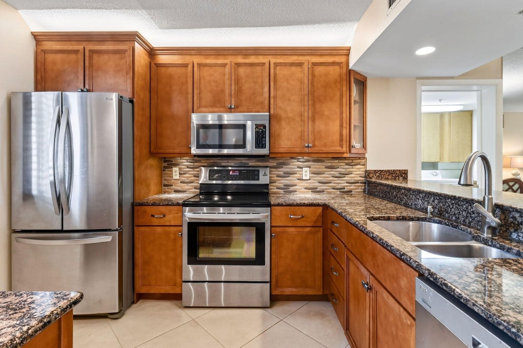 Photo of 2101 Marina Isle Way #202, Jupiter, FL 33477 (MLS # B26062804)