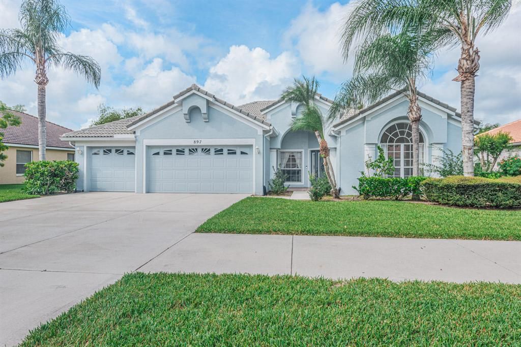 Photo of 897 SW Lake Charles Circle, Port Saint Lucie, FL 34986 (MLS # R10669634)