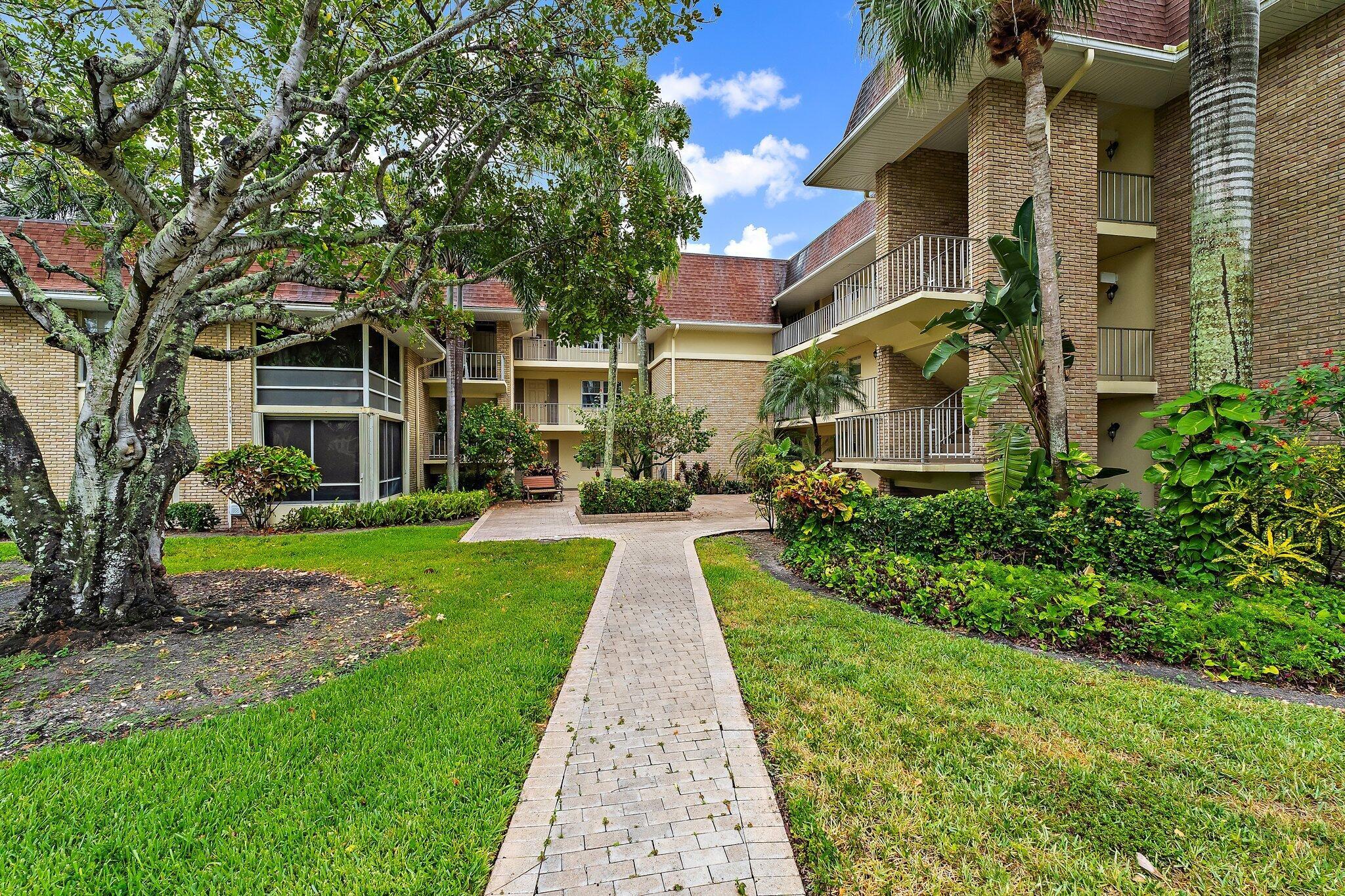 Desirable first floor two bedroom condominium with a freshly painted interior, enclosed porch, accordion hurricane protection and a dedicated carport is move in-ready for a new owner. Spacious split floor plan offers ceramic tile flooring in the living areas, laminate wood flooring in the bedrooms, crown moldings, ceiling fans & plantation shutters. Updated kitchen is open to the living room and has updated appliances & cabinetry. Large open living & dining area with access to the enclosed patio. Master suite offers a renovated en-suite full bathroom and a walk-in closet. Guest suite is located on the opposite side of the home, has ample closet space, and an en-suite full bathroom. Condo is located steps away from community laundry room. Exterior features accordion hurricane protection,