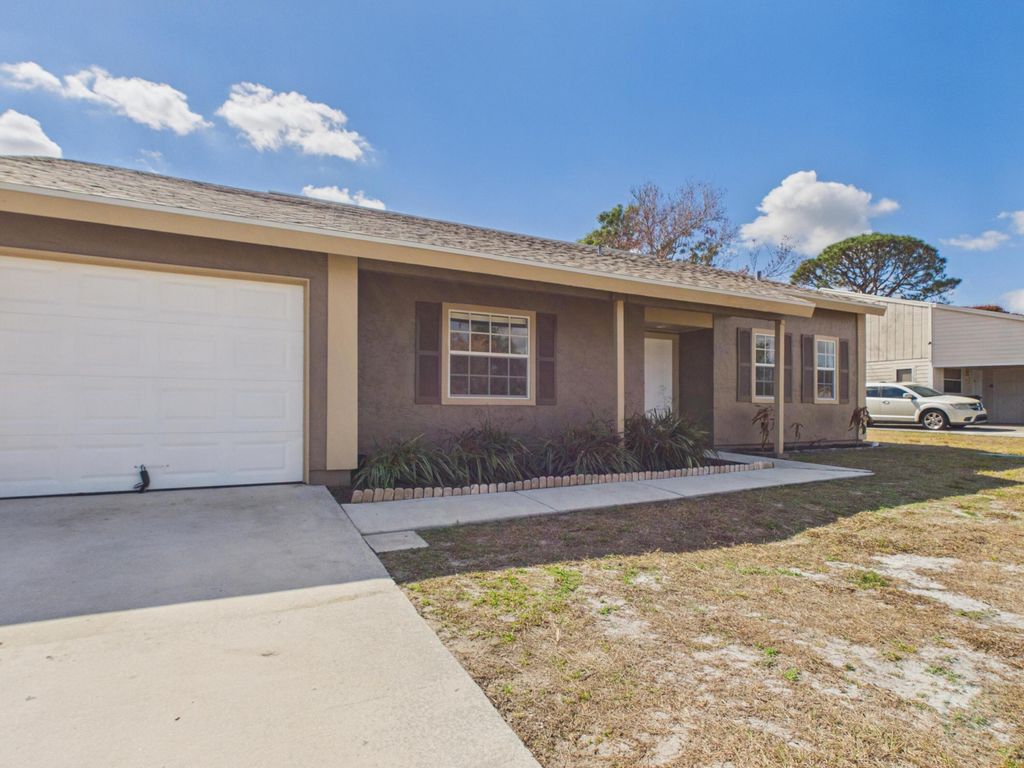 Photo of 240 SE Twig Avenue, Port Saint Lucie, FL 34983 (MLS # R11163712)