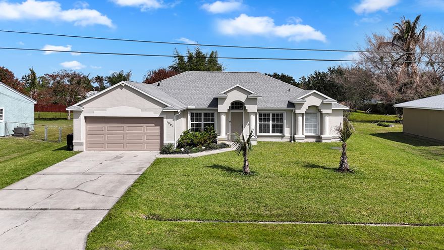 Move-in ready with a functional open layout, vaulted ceilings, and a spacious backyard on an oversized lot, this home offers strong value in a convenient Port St. Lucie location. Thoughtfully maintained throughout with updated lighting and neutral finishes, this home is clean, comfortable, and ready for immediate occupancy, no projects needed.  Inside, the layout is practical and functional, with defined living and dining spaces and a kitchen that opens directly to the main living area. The primary suite includes dual vanities, a soaking tub, and separate shower, while the additional bedrooms offer flexibility for guests, office space, or family.  A ton of value here, this is a smart buy thanks to it's great condition, CBS construction, 2k square footage, and a large yard w/room for pool. It's location adds to the appeal. Just minutes to US-1, I-95, and the Turnpike, with quick access to shopping, dining, and everyday essentials. You're also close to parks, golf, and a short drive to Jensen Beach, downtown Stuart, and Hutchinson Island beaches, giving you a balance of convenience and lifestyle.