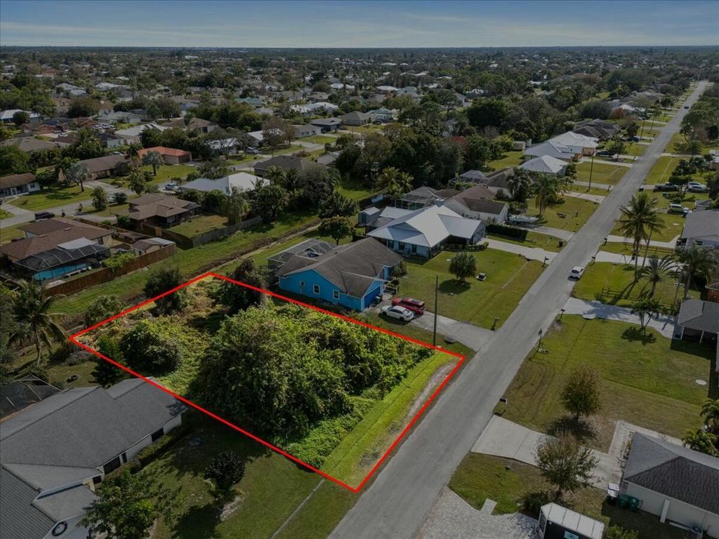 Photo of 2433 SW Hinchman Street, Port Saint Lucie, FL 34984 (MLS # R11053995)