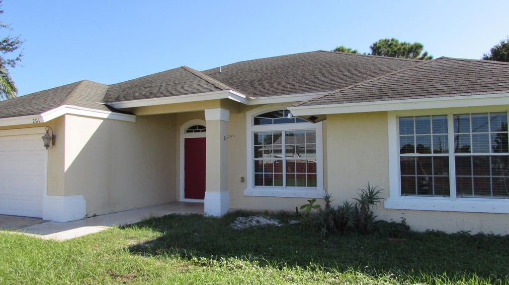 Photo of 2311 SW SUSSET Lane, Port Saint Lucie, FL 34953 (MLS # B26082953)
