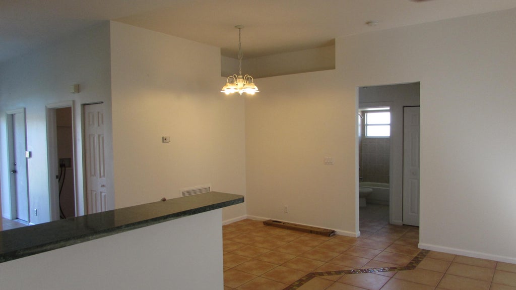 Photo of 2311 SW SUSSET Lane, Port Saint Lucie, FL 34953 (MLS # B26082953)