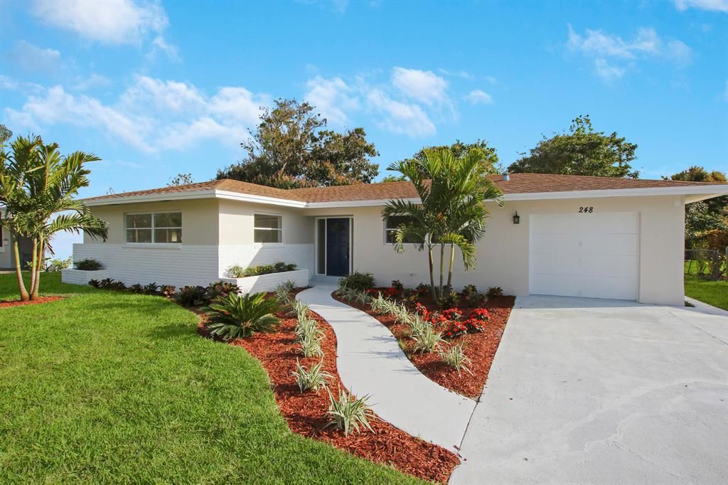 Photo of 428 Hawthorne Drive, Lake Park, FL 33403 (MLS # R10695687)