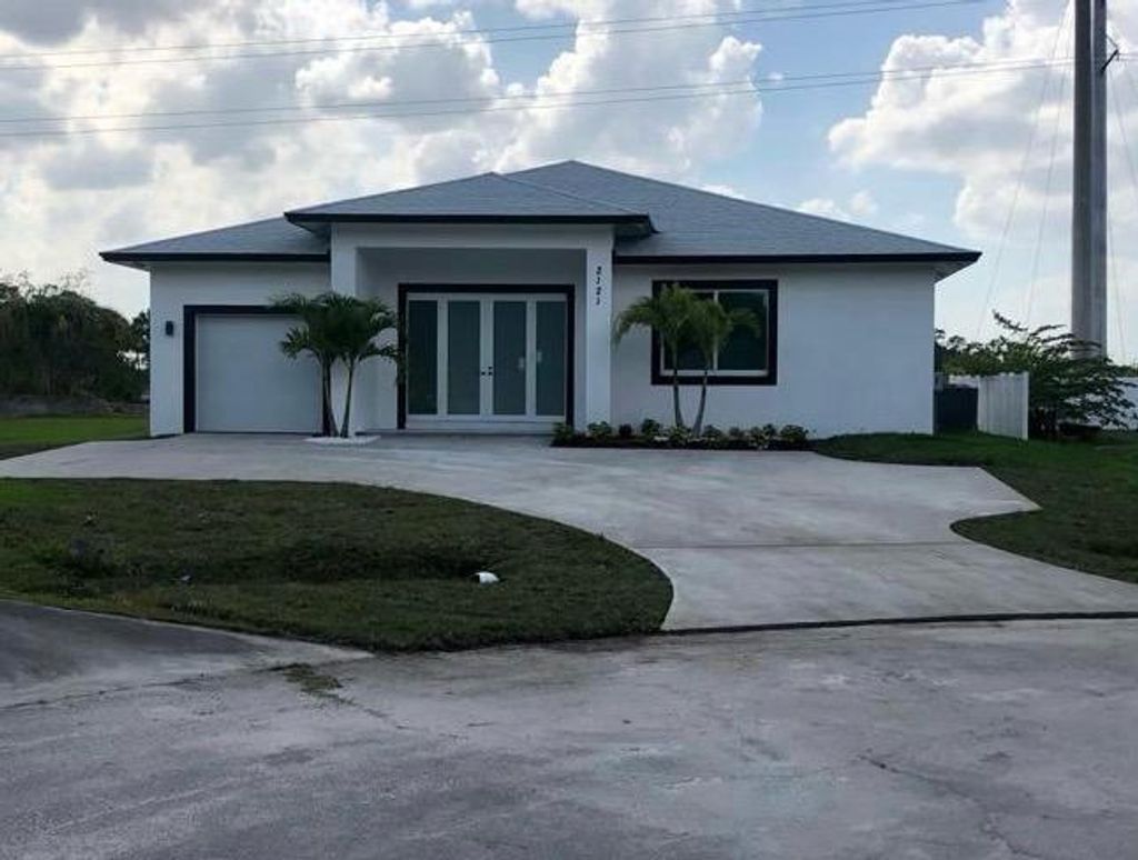 Photo of 2121 SW Vixen Court, Port Saint Lucie, FL 34953 (MLS # R10705901)