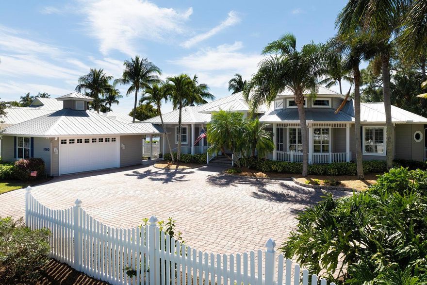 This property is designed in Key West style and is on a beautifully landscaped 1.24-acre lot. The 3-bed/2.5-bath residence boasts stunning views of the lake and preserve and features a metal-roof with over 2,700 sq ft. of living space. It also features an oversized 2+ car AC garage. Additionally, a half-acre parcel adjacent to the property features a pole barn with utilities that will accommodate a ''Class A'' RV. Otter's Run is a collection of custom-designed homes in Palm City, Florida. These homes are located within the boating communities of Lighthouse Point and Seagate Harbor, offering a unique combination of peaceful country living and in-town convenience.