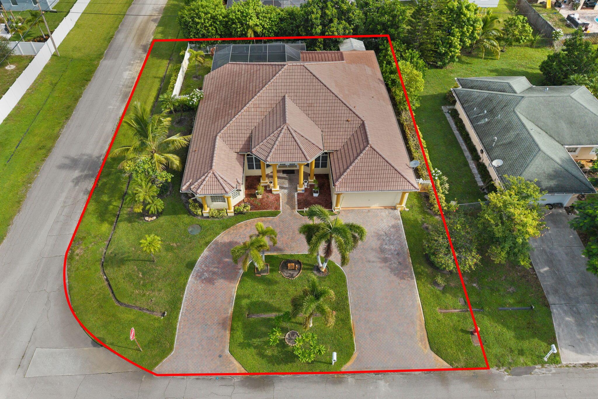 You have found your dream home!!! Property is situated on a corner lot with great highway access. This well-maintained, custom built, 4-bedroom 3 bath pool home has been owner occupied since new. The triple split floor plan is perfect for multi-generational living. Pull up in the circular paver driveway and you will adore the grand entrance. Walk through the double front doors and say wow!! Soaring ceilings, office/ den to the left, formal dining room to the right and straight ahead.... you'll step down to the sitting room with gorgeous views of the saltwater pool and spa. The gourmet kitchen anchors the home and overlooks the large family room, offers a pocket door to the formal dining room and convenient access to the garage and laundry room.