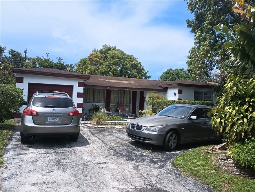Genuine 2 Bedroom 2 Bathroom, Total building area 2127 Sq. Ft, including, Enclosed Garage, very large back porch. ideal for an imaginative owner to maximize the full potential of this gem to make your own Palace or add to your  Investment portfolio.  Very central location close to University Dr. and Pembroke Rd, Under 10 minutes to the Hard Rock Stadium, Same to the Turnpike and I 95 with close connection to I 75 . This will not last, come with your best offer, Seller will need 60 days for relocation. text agent for viewing.