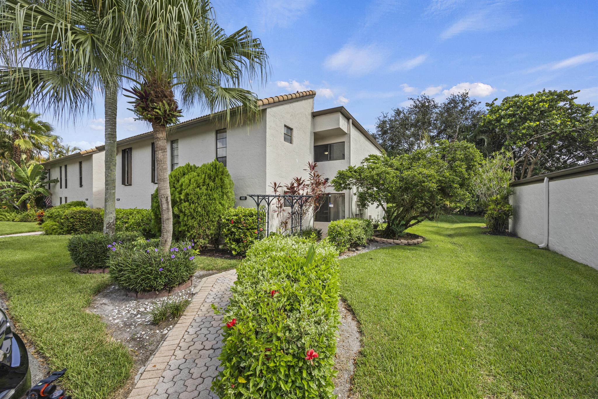 Experience the perfect blend of space, privacy, and scenic views in this rare 4-bedroom, 2.5-bath corner-unit townhome, ideally situated in the heart of Plantation. Nestled on the 7th fairway of the Jacaranda Golf Course, this home offers tranquil golf course vistas and a lush, private patio oasis surrounded by mature tropical foliage--ideal for entertaining or unwinding in peace. Inside, you'll find an expansive layout featuring an open concept floor plan, enormous kitchen, bar area, dining room. full laundry room, 1st floor bedroom & powder room. A mix of impact windows, and newer A/C systems offers year-round comfort. The thoughtful design offers both functionality and flexibility, making it perfect for families or those seeking generous living space. Located in a beautifully maintained