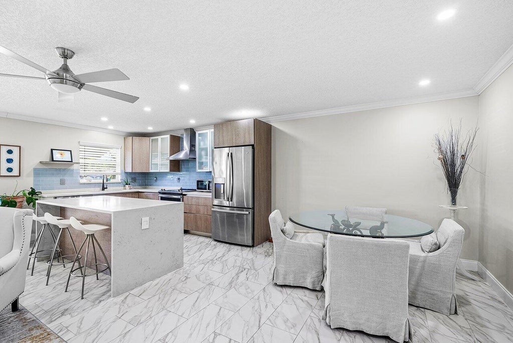 Photo of 810 High Point Drive W #C, Delray Beach, FL 33445 (MLS # R11136409)