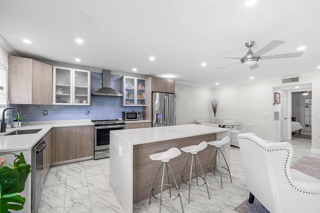 Photo of 810 High Point Drive W #C, Delray Beach, FL 33445 (MLS # R11136409)