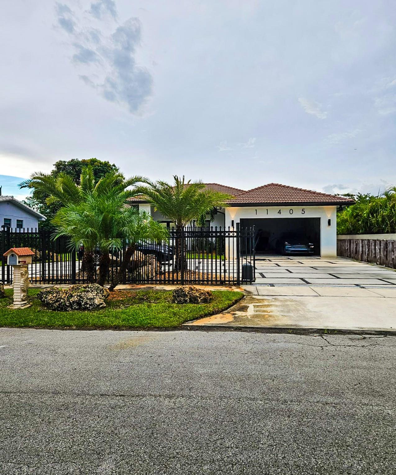 This stunning 4-bedroom, 3-bath single-family home offers 2,483 sq. ft. of living space behind a secure gated entry. Featuring a Mediterranean-style tile roof, lush palm landscaping, and a spacious driveway with 2-car garage, the home combines elegance and functionality. Enjoy modern finishes throughout and a private fenced yard ideal for outdoor gatherings. Conveniently located in a desirable neighborhood, this property blends privacy, style, and everyday comfort.