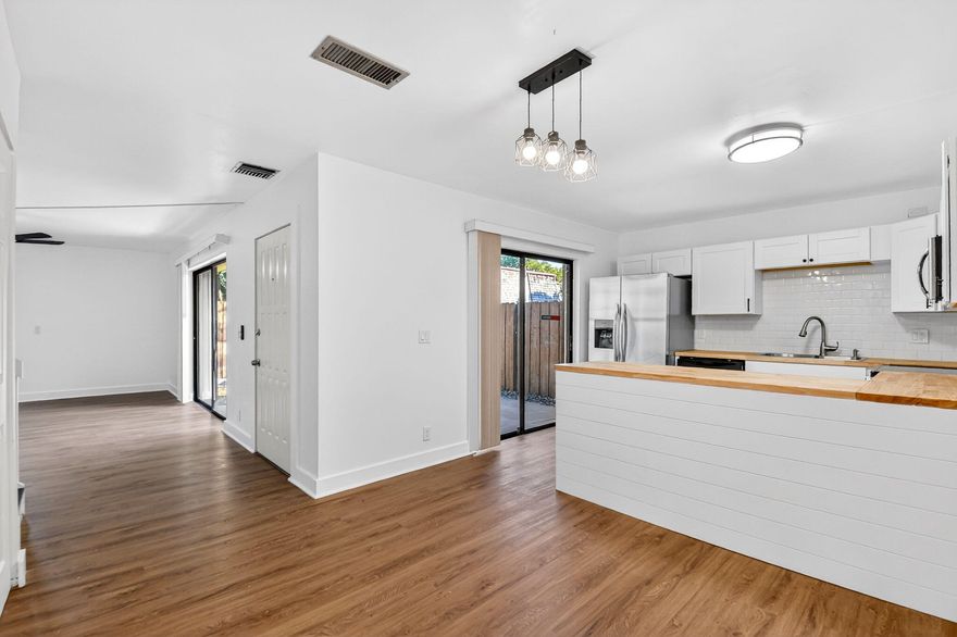 Welcome to this gorgeous 2/2 townhome. This home has been thoughtfully updated from top to bottom, featuring a brand-new roof, new AC, new flooring, fresh interior paint, updated bathrooms, and a new electric panel. The modern kitchen shines with white cabinetry, butcher block countertops, and new stainless steel appliances, perfect for both everyday living and entertaining.
Both bedrooms are generously sized, offering comfort and flexibility. Enjoy outdoor living in the fenced-in front patio, and rest easy with accordion hurricane shutters throughout. The community offers a low monthly HOA, a children's playground, and scenic walking paths. Each unit includes two assigned parking Spaces. Great opportunity to add a performing rental to your portfolio! This well-maintained property is currently tenant occupied, providing immediate cash flow at closing.