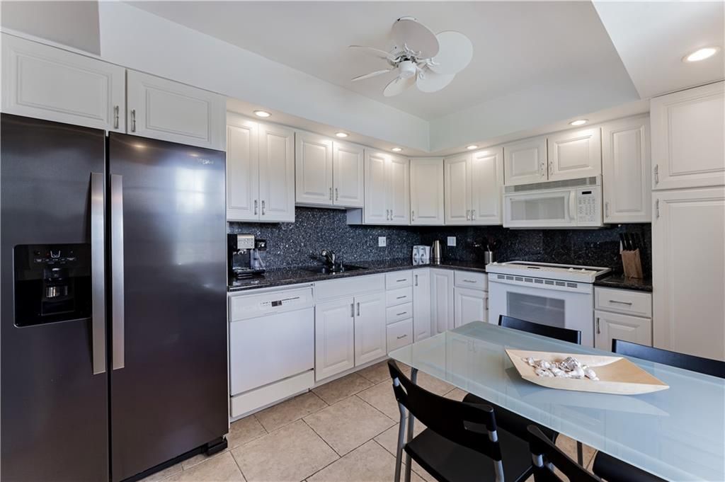 Photo of 3900 Oaks Clubhouse Dr Dr #310, Pompano Beach, FL 33069 (MLS # F10343053)